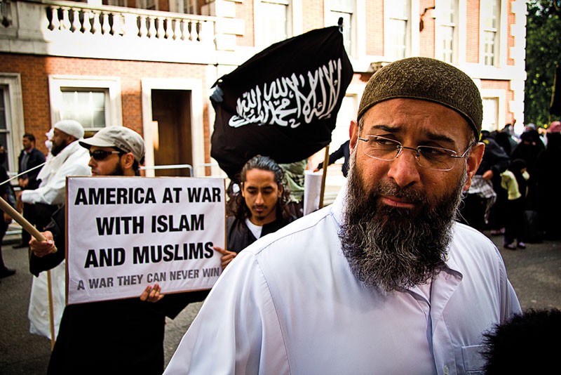 anjem choudary is speaking to a group of people outside