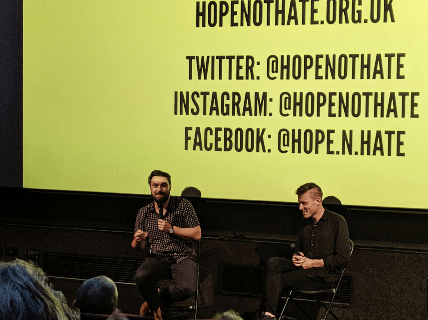 Joe (left) and Patrik (right) hosting a Q&A session. They're sitting in front on a yellow screen