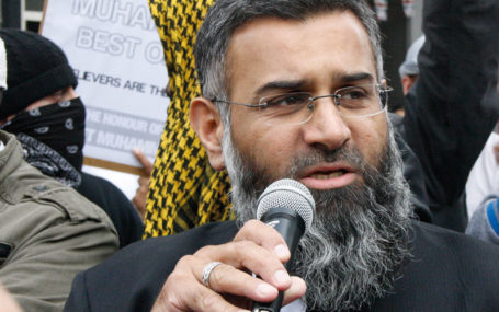 anjem choudary is speaking to a group of people outside