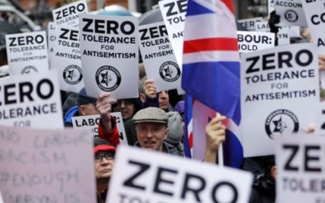 People holding placards, protesting against antisemitism in the Labour Party