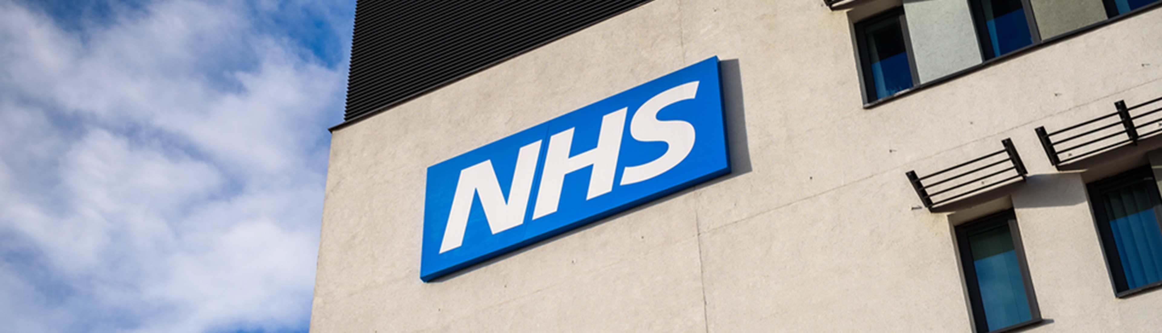 a picture of a building with the "NHS" sign on it
