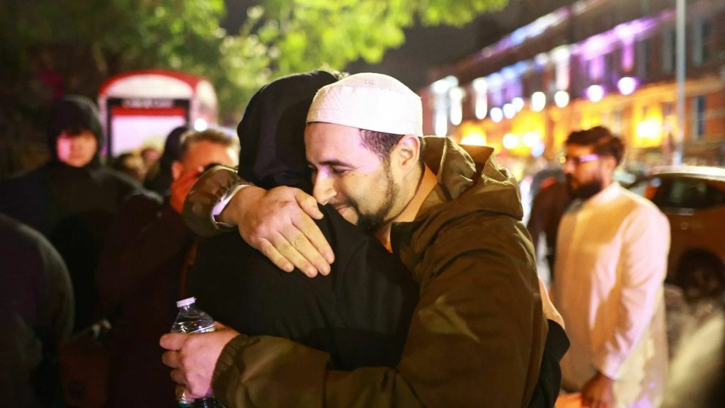 Imam, Adam Kelwick, decided to talk to a gathering of protestors who were outside his mosque.