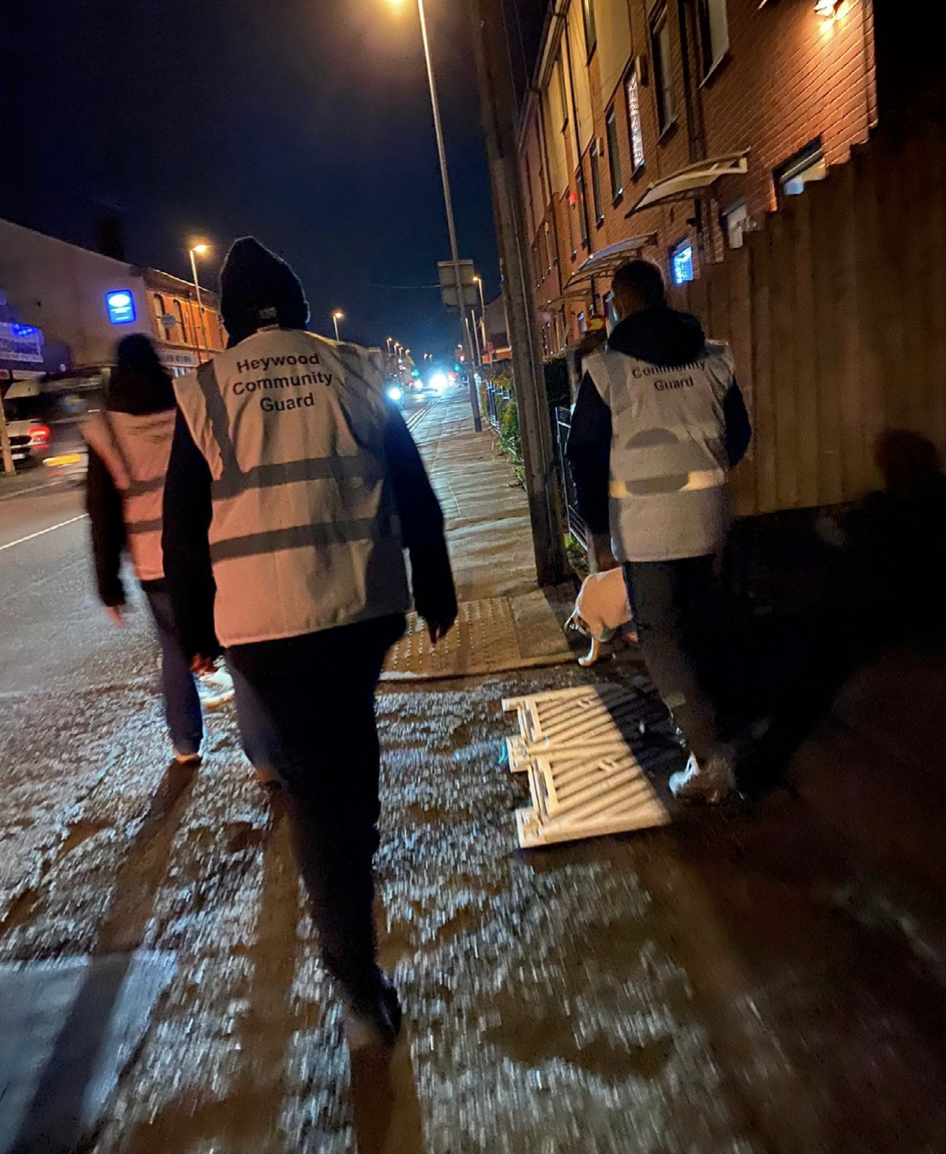 Heywood Community Guard members in group hi-vis vests